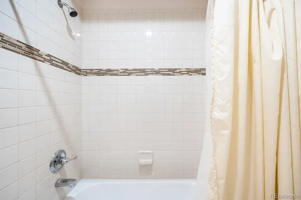 a bathroom with a shower and a bathtub
