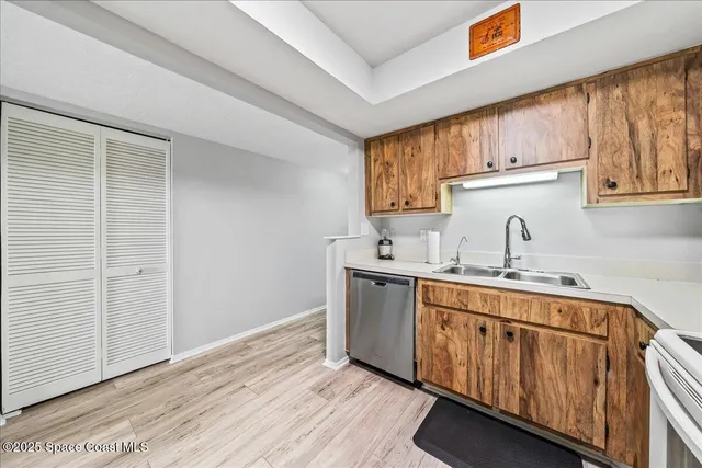 a kitchen with sink cabinets and window