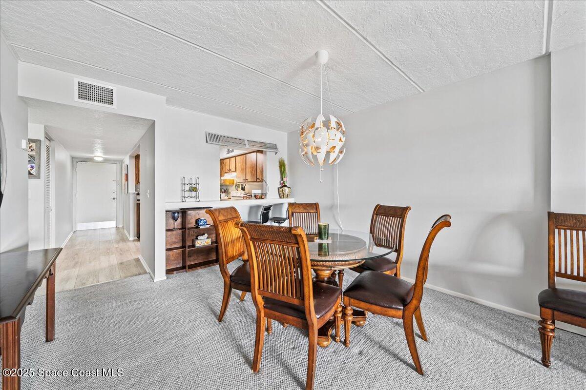 2775 North Wickham Road, Unit A403 Melbourne, FL 32935 - Photo 5 of 24 Dining Area