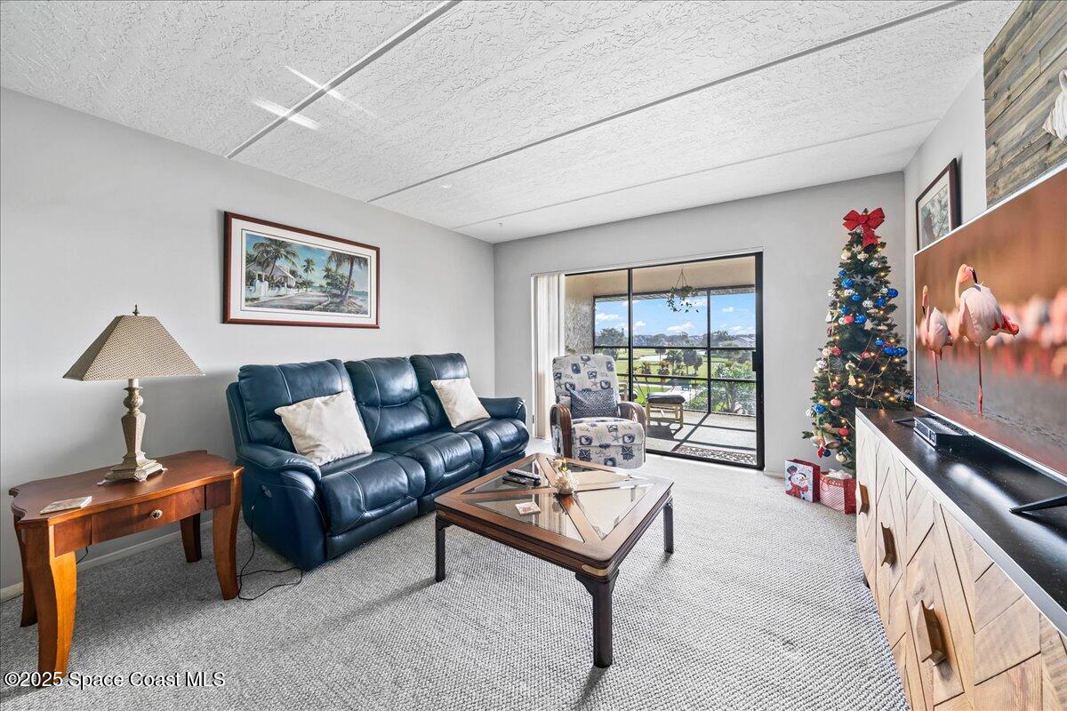 2775 North Wickham Road, Unit A403 Melbourne, FL 32935 - Photo 8 of 24 Family room