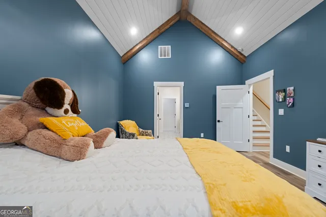 a bedroom with bed and window