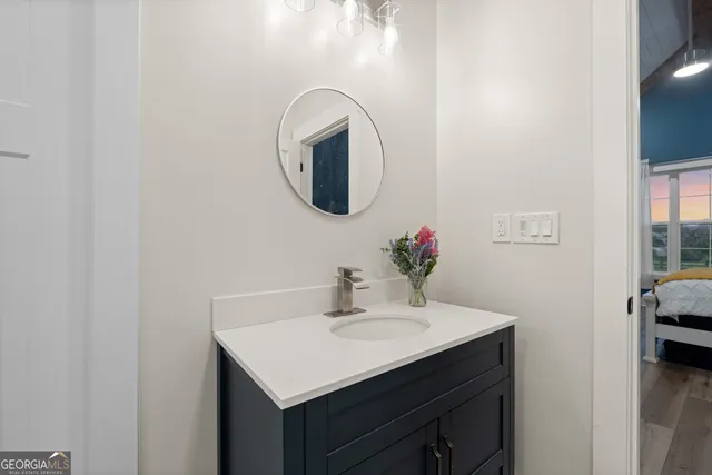 a bathroom with a sink and a mirror