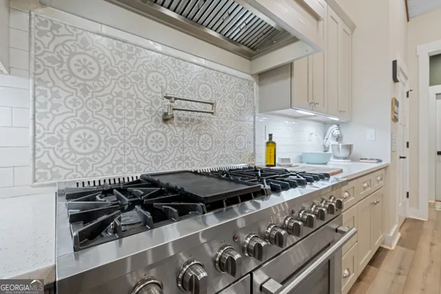 a kitchen with a stove and a sink