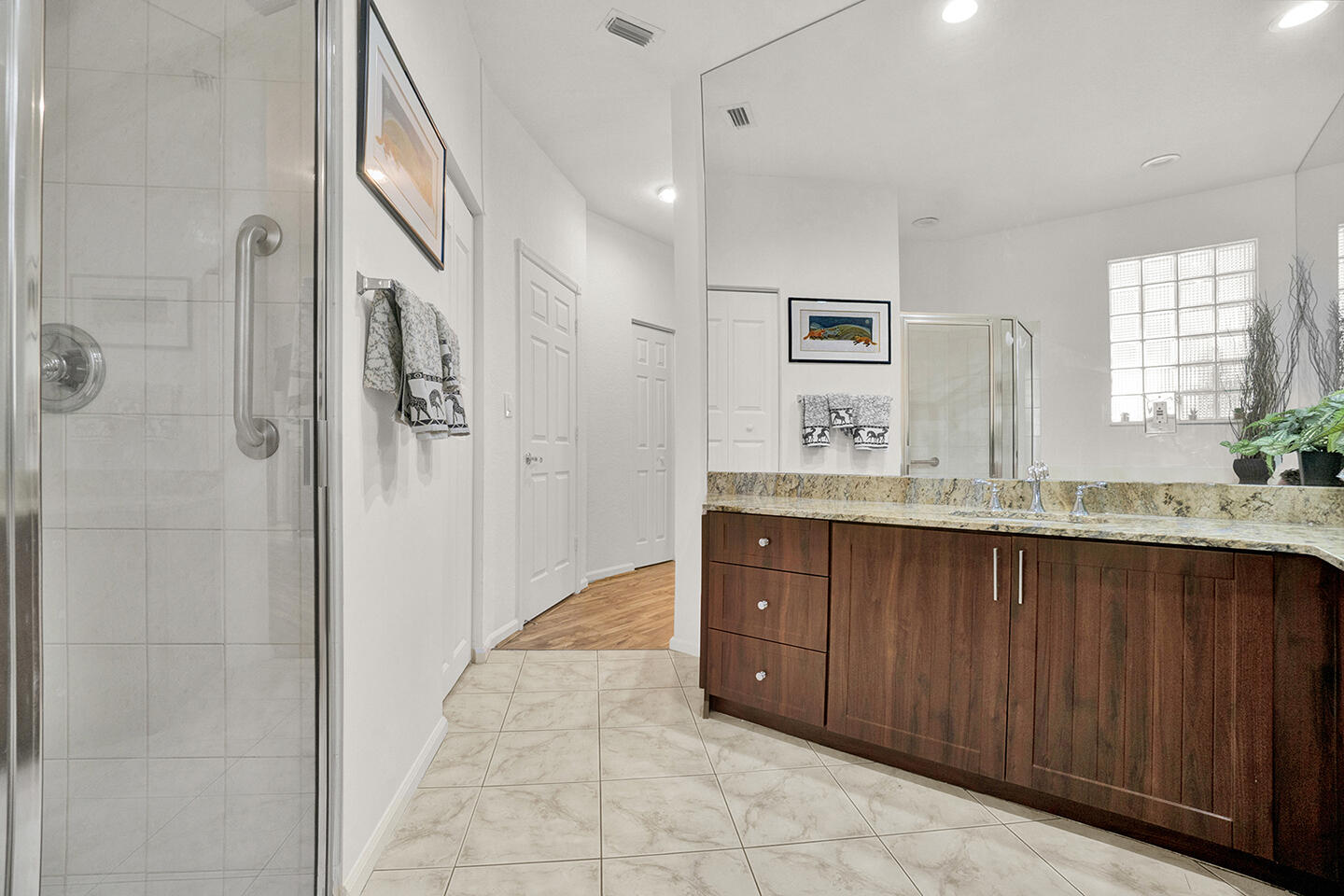 22831 Windsor Wood Court Boca Raton, FL 33433 - Photo 18 of 48 a spacious bathroom with a granite countertop sink a mirror and a shower