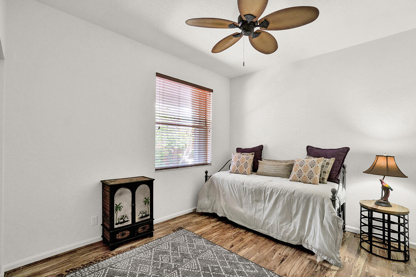 22831 Windsor Wood Court Boca Raton, FL 33433 - Photo 19 of 48 a bedroom with a bed and window