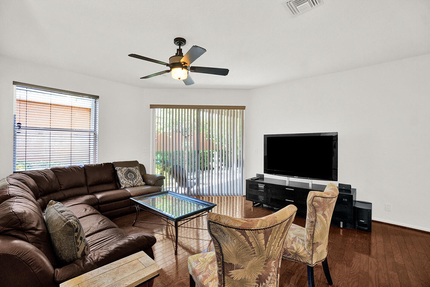 22831 Windsor Wood Court Boca Raton, FL 33433 - Photo 26 of 48 a living room with furniture and a flat screen tv