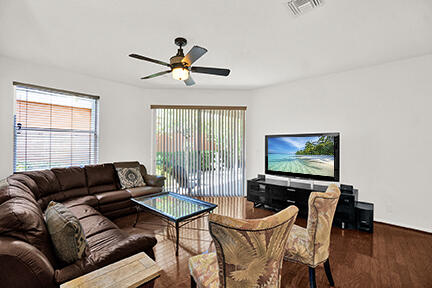 22831 Windsor Wood Court Boca Raton, FL 33433 - Photo 27 of 48 a living room with furniture and a flat screen tv