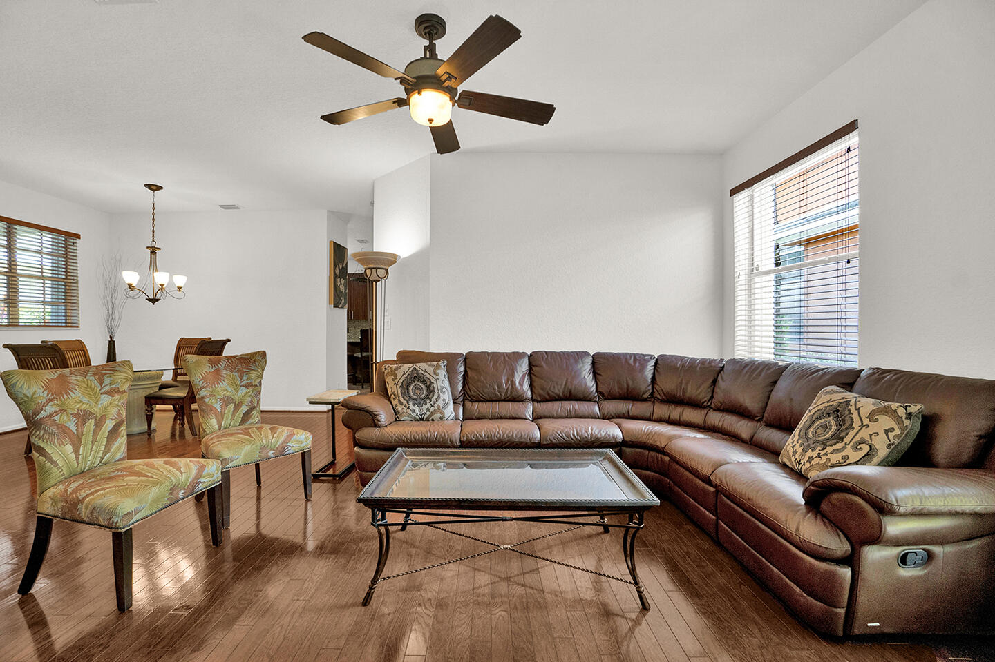 22831 Windsor Wood Court Boca Raton, FL 33433 - Photo 29 of 48 a living room with furniture a ceiling fan and a window
