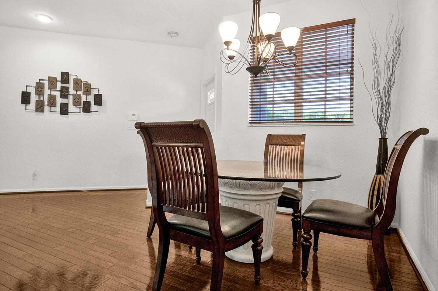 22831 Windsor Wood Court Boca Raton, FL 33433 - Photo 30 of 48 a view of a dining room with furniture and wooden floor