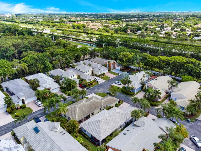 an aerial view of a house with a lake view