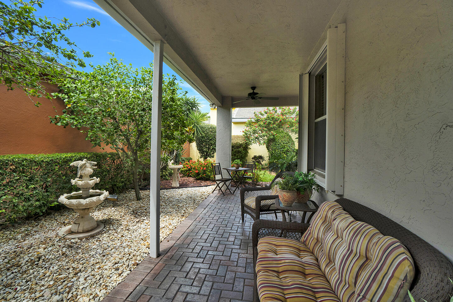 22831 Windsor Wood Court Boca Raton, FL 33433 - Photo 33 of 48 a view of a porch with chairs and backyard