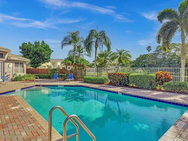 a view of a swimming pool with a patio