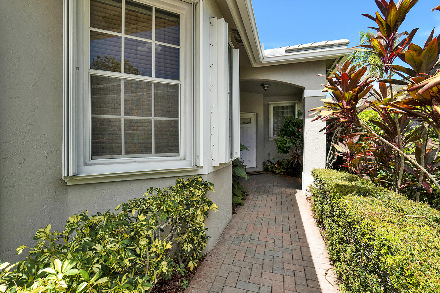 22831 Windsor Wood Court Boca Raton, FL 33433 - Photo 6 of 48 a house with a lot of flower plants
