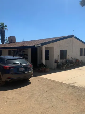 a view of car parked in front of house