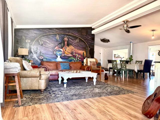 a living room with furniture and a rug