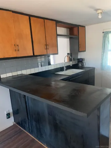 a kitchen with a sink and a window