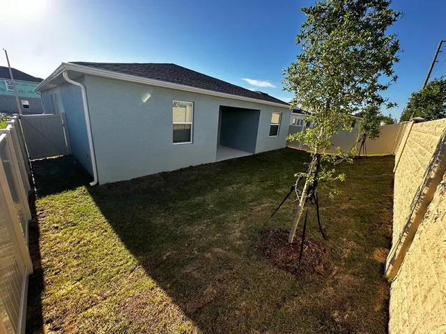 a house view with a backyard space