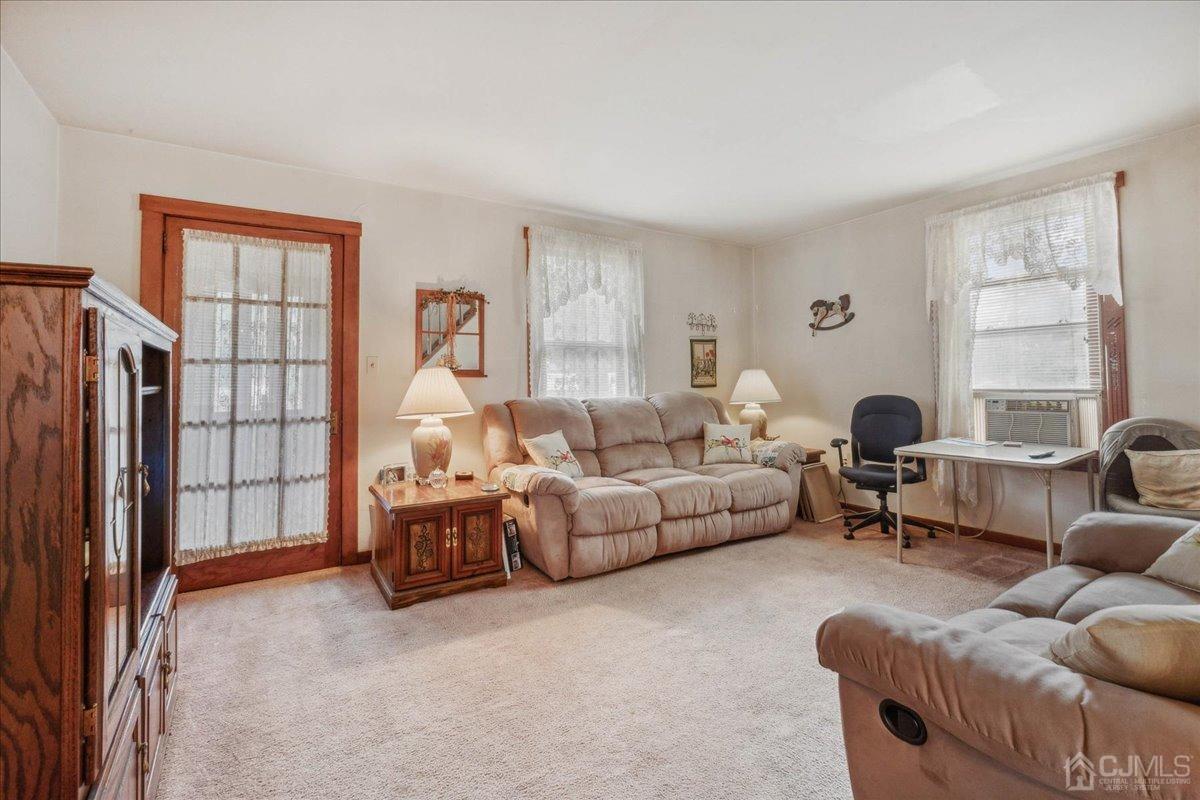 186 Cottrell Road Old Bridge, NJ 07747 - Photo 4 of 16 a living room with furniture and a large window