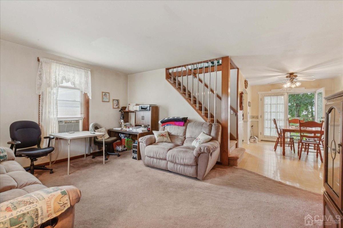 186 Cottrell Road Old Bridge, NJ 07747 - Photo 5 of 16 a living room with furniture and a potted plant