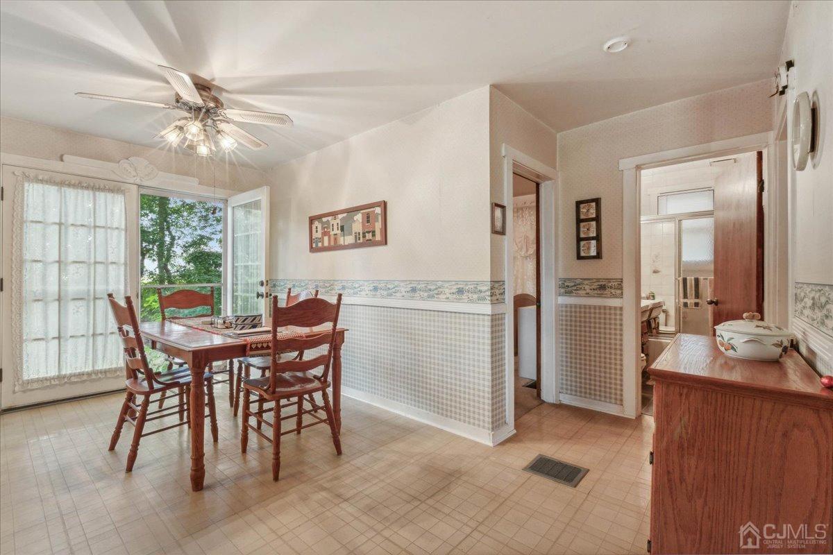 186 Cottrell Road Old Bridge, NJ 07747 - Photo 6 of 16 a view of a dining room with furniture and a chandelier