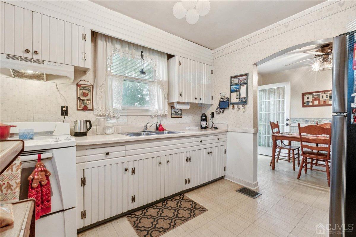 186 Cottrell Road Old Bridge, NJ 07747 - Photo 8 of 16 a kitchen with sink and cabinets