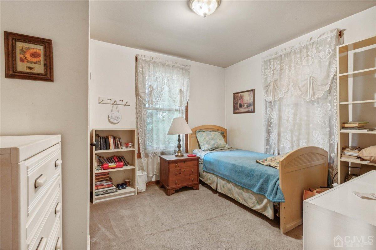 186 Cottrell Road Old Bridge, NJ 07747 - Photo 9 of 16 a bedroom with a bed and a window