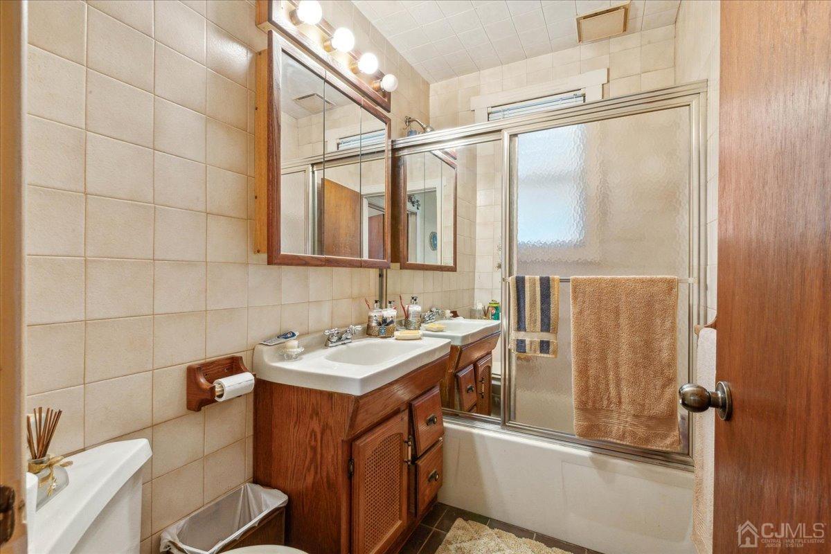 186 Cottrell Road Old Bridge, NJ 07747 - Photo 10 of 16 a bathroom with a sink and a mirror