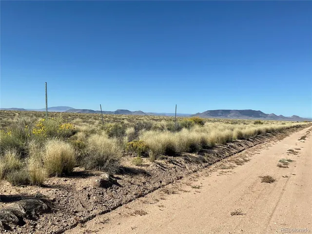 a view of a road with an ocean view