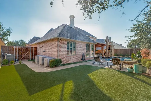 a front view of house with a garden and patio