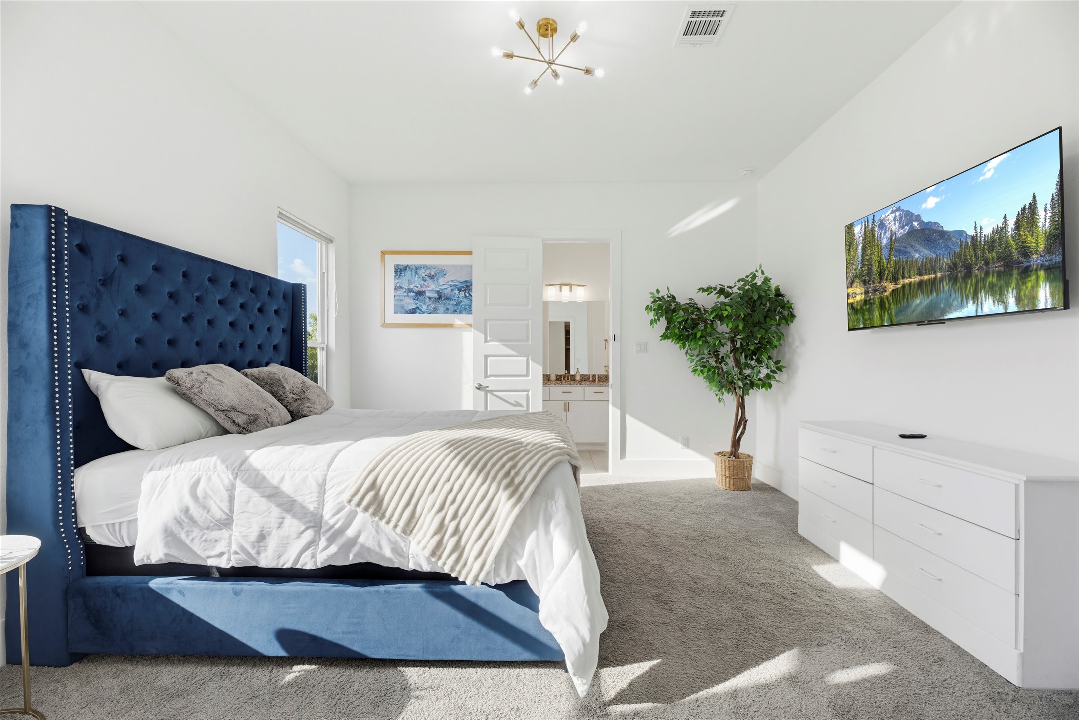 29526 Cir S Rnch Trail Fulshear, TX 77406 - Photo 25 of 48 a bedroom with a large bed and a flat screen tv