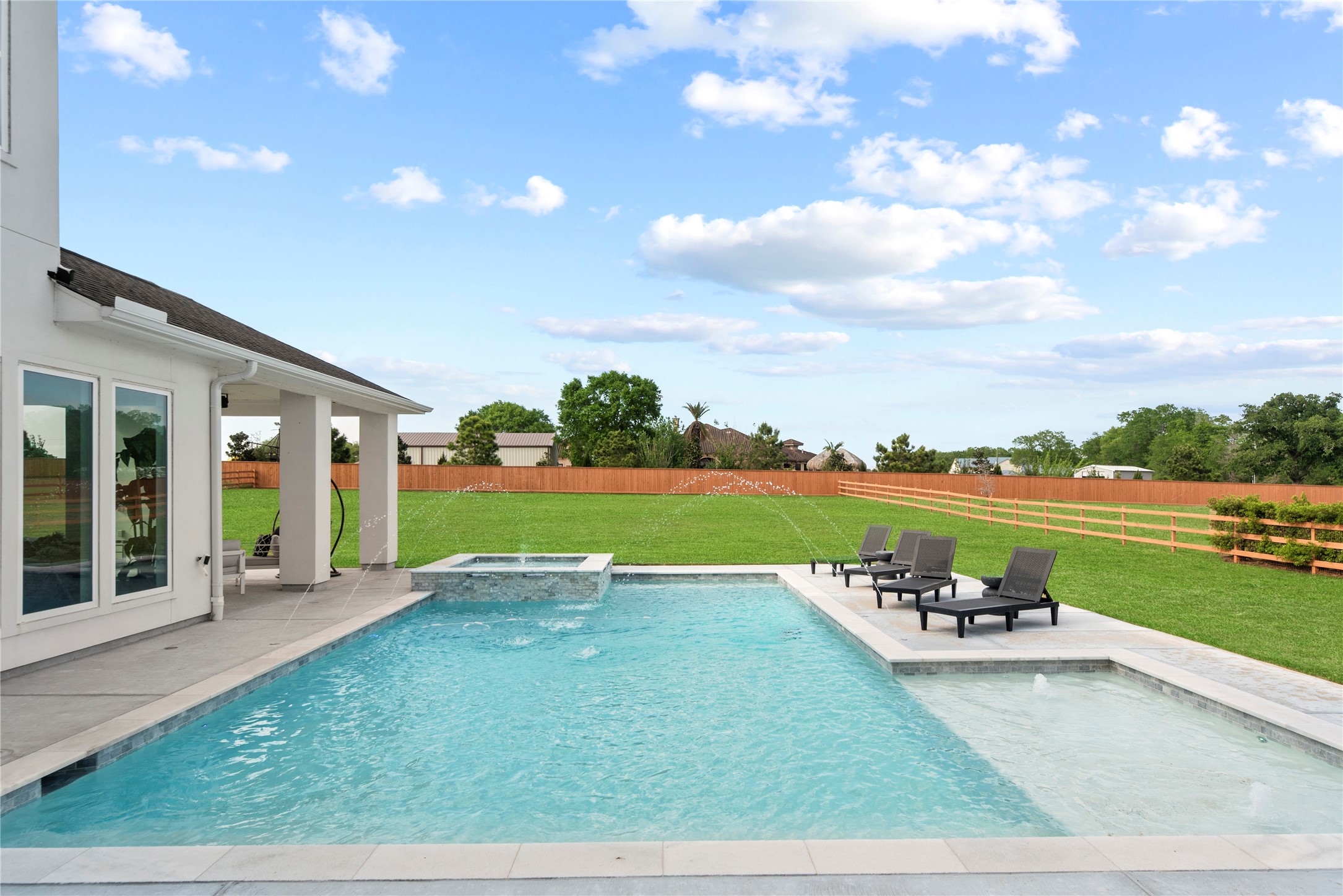 29526 Cir S Rnch Trail Fulshear, TX 77406 - Photo 32 of 48 a view of swimming pool with outdoor seating and yard