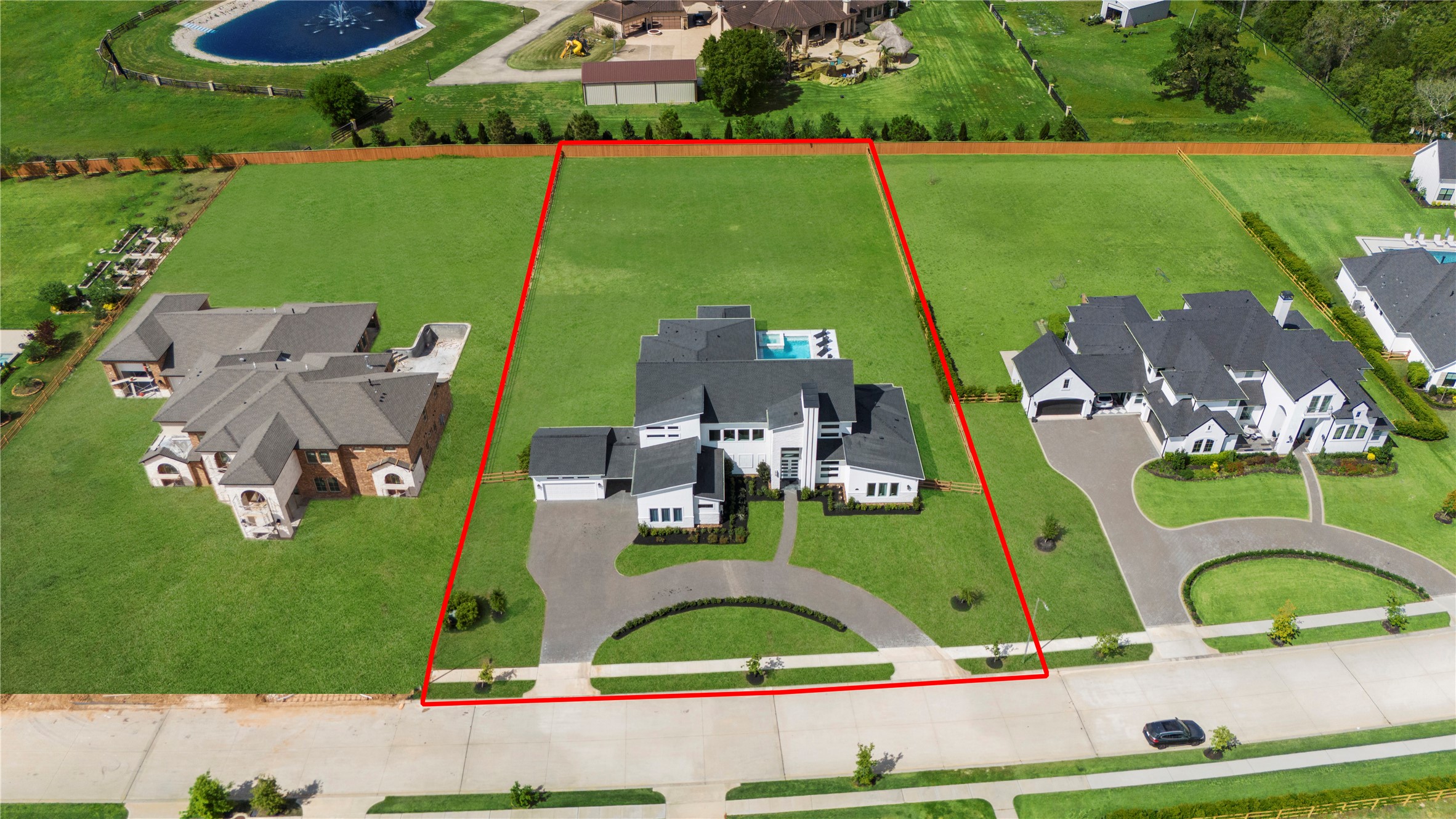 29526 Cir S Rnch Trail Fulshear, TX 77406 - Photo 37 of 48 an aerial view of a house with a garden and large trees