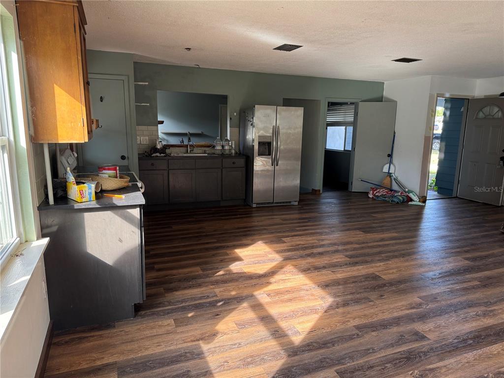 861 Palermo Road St. Augustine, FL 32086 - Photo 12 of 33 a kitchen with granite countertop a refrigerator and a sink