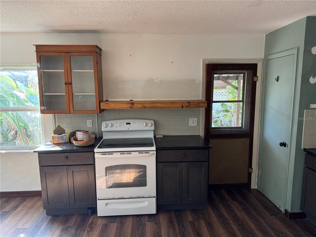 861 Palermo Road St. Augustine, FL 32086 - Photo 15 of 33 a kitchen with a stove and wooden floor