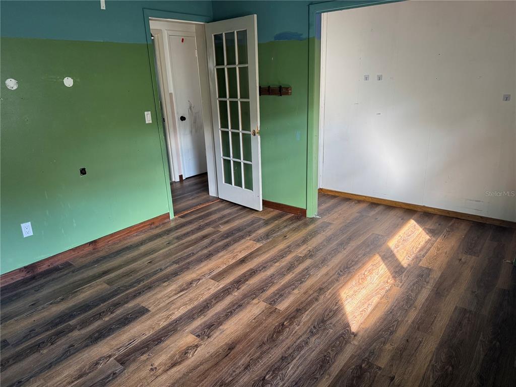 861 Palermo Road St. Augustine, FL 32086 - Photo 20 of 33 a view of a room with wooden floor and windows