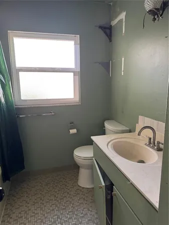 a bathroom with a sink and a toilet