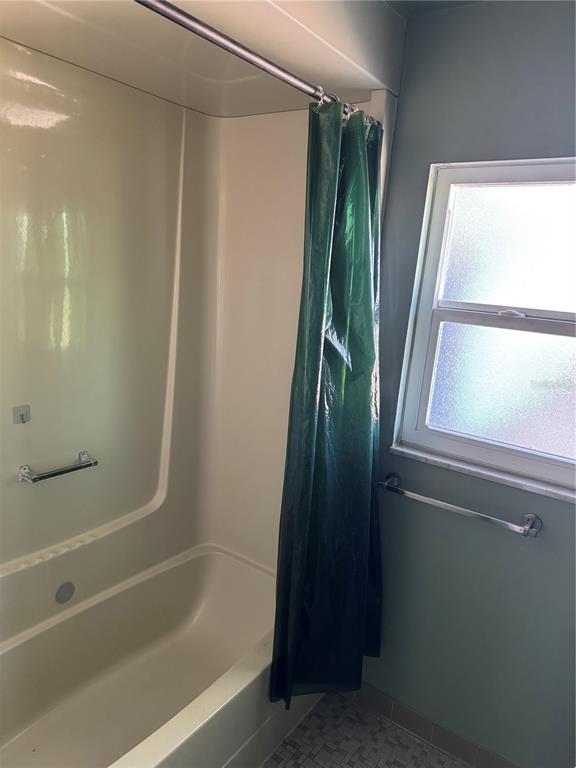 861 Palermo Road St. Augustine, FL 32086 - Photo 25 of 33 a bathroom with a bathtub and a shower