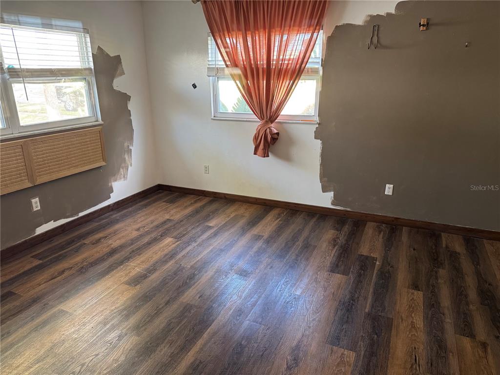 861 Palermo Road St. Augustine, FL 32086 - Photo 26 of 33 wooden floor in an empty room with a window