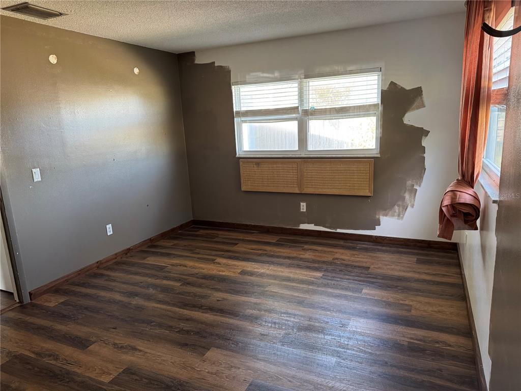 861 Palermo Road St. Augustine, FL 32086 - Photo 28 of 33 a view of empty room with wooden floor and fan