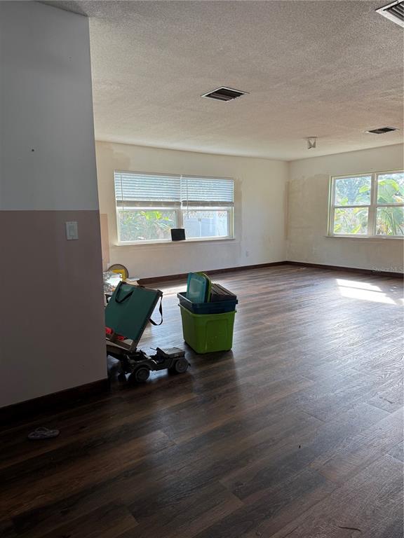 861 Palermo Road St. Augustine, FL 32086 - Photo 6 of 33 a room with wooden floor pool table and windows
