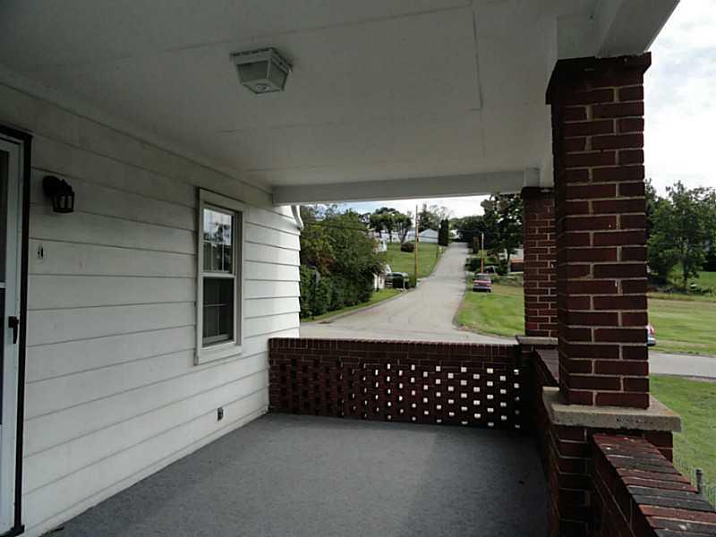 4015 Chieftan Road Irwin, PA 15642 - Photo 14 of 24 Patio/Deck. This spacious, covered side porch allows for great outdoor living.