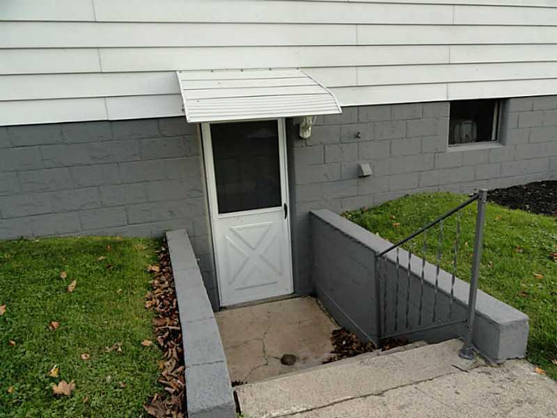 4015 Chieftan Road Irwin, PA 15642 - Photo 20 of 24 Exterior Back. Walk-out door from the basement to the back yard.