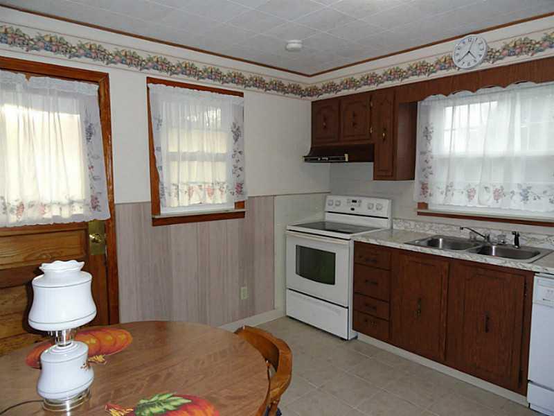 4015 Chieftan Road Irwin, PA 15642 - Photo 5 of 24 Kitchen. The eat-in-kitchen is 12 x11 with access to the large side porch.