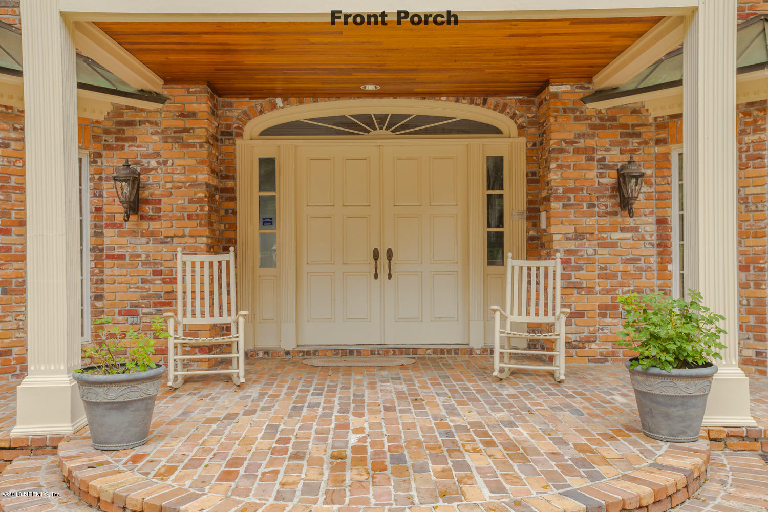 12584 Mandarin Road Jacksonville, FL 32223 - Photo 4 of 26 a view of a porch with potted plants