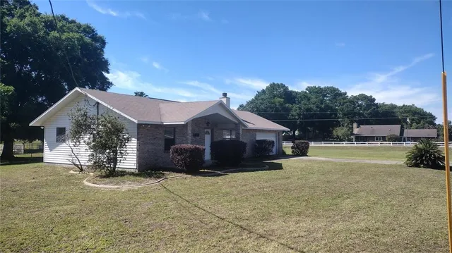 a view of a house with a yard