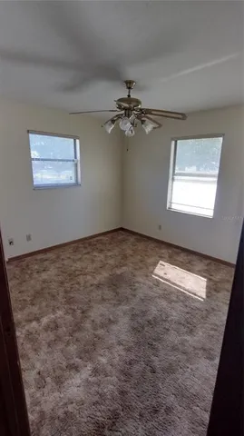 a view of a utility room with cabinets