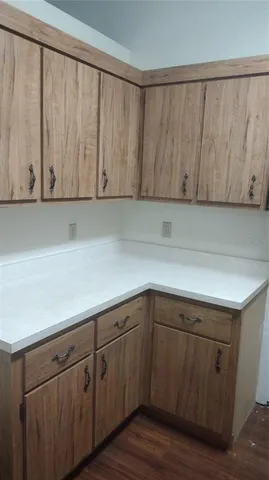 a utility room with a refrigerator