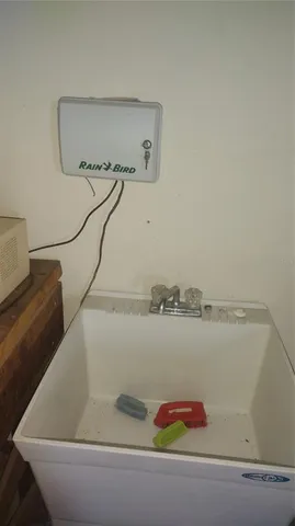 a picture of a room with a ceiling fan