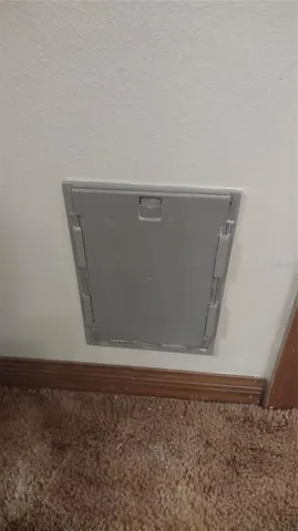 a view of a kitchen with a sink and cabinets