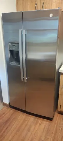 a bathroom with a toilet and a mirror